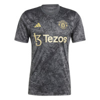 adidas Manchester United Pre-Match Trainingsshirt Stone Roses 2023-2024 Zwart Donkergrijs Goud