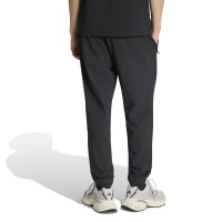 adidas Tech Essential Woven Trainingspak Zwart Zilver